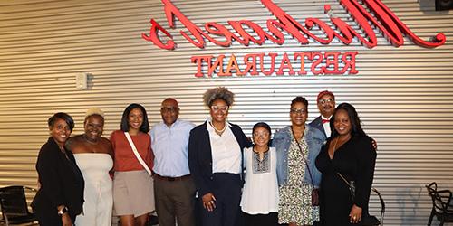 Group of Black Alumni Society members in front of Michael's Restaurant.